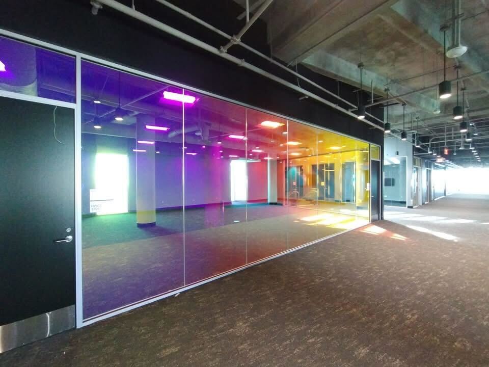 Commercial window film upgrade at Tarrant County College Northwest Campus with 3M Dichroic Chill and Blaze applied to interior glass.