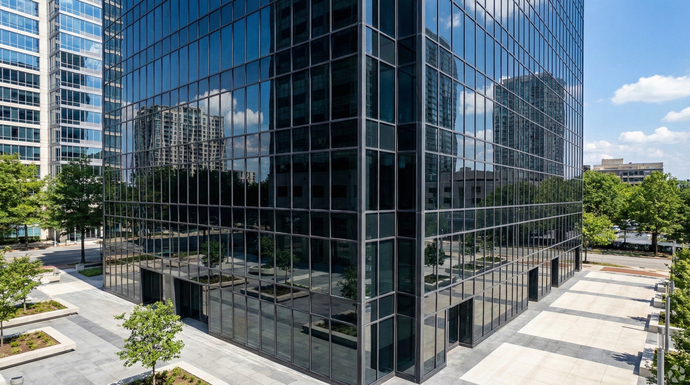 One-way mirror window film providing daytime privacy on commercial building glass